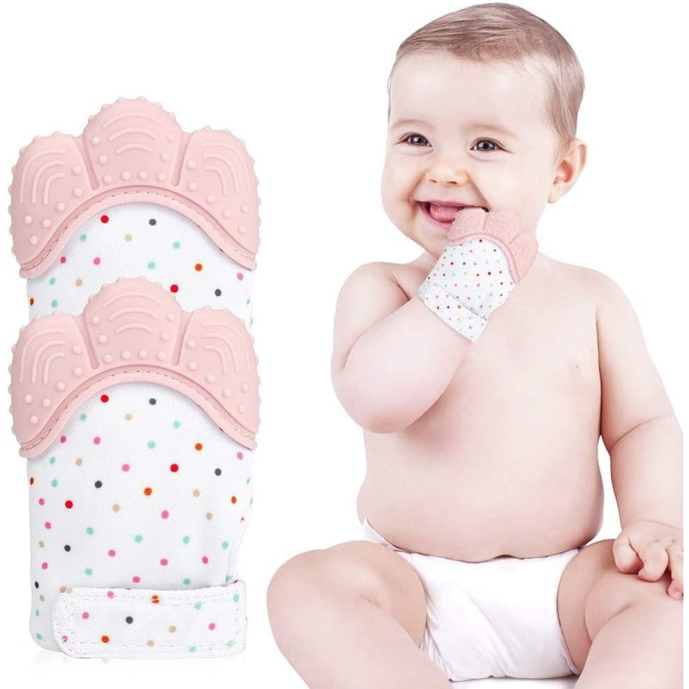 a baby is holding a toothbrush in its mouth